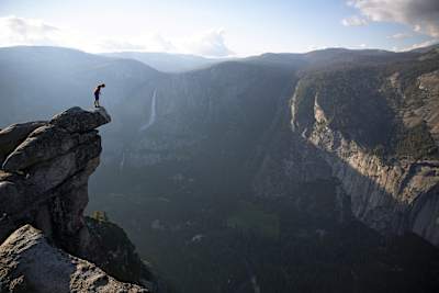 Honnold surveys a vast drop below him