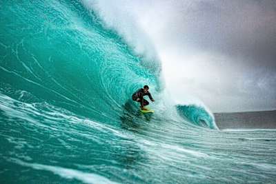 Vans pro rider Seb Smart surfing at Sennen, Cornwall