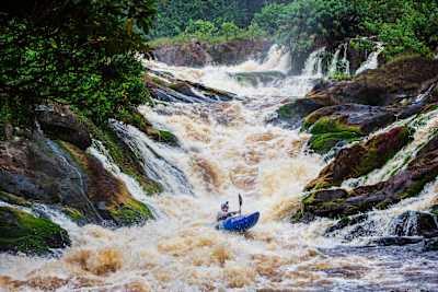 Kayaker Adrian Mattern descends a set of rapids on the Ivindo River in Gabon.