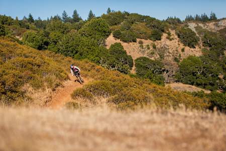 Freestyle MTB rider Matt Jones riding the trails outside Fairfax