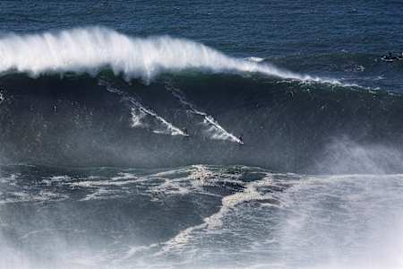Carlos Burle and Rodrigo Koxa at Praia do Norte in Nazare, Portugal in 2017