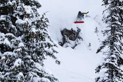 Spencer O’Brien jumps from a cliff during Day 1 of Natural Selection Snow in Revelstoke, Canada in March 2026.