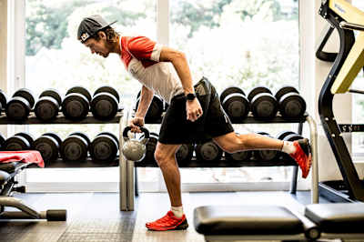 Ryan Sandes is seen weight-training ahead of running The Great Himalaya Trail.