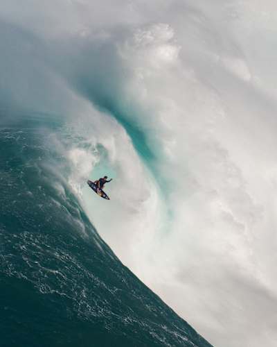 Kai Lenny surfs in Peahi on Maui