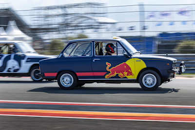 Max Verstappen and Yuki Tsunoda driving DAF 66s during Red Bull Reverse at Circuit Zandvoort, Netherlands.