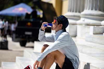 A participant drinking during the Wings for Life World Run App Run Event in Athens, Greece, on May 7, 2023.