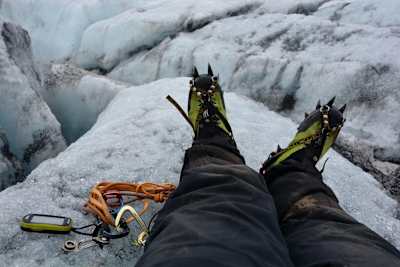 Grzegorz Gawlik takes a break while scaling an icy volcano.