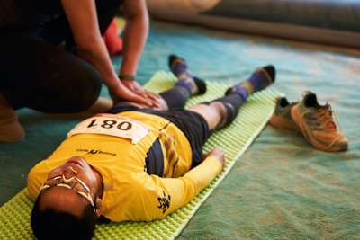 A competitor receiving a mid-race massage