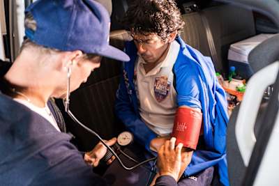 Cyclist getting his blood pressure taken