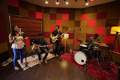 Musicians perform in the recording booth of Compass Box Stuio in Ahmedabad.