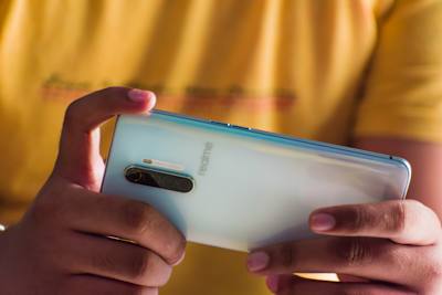 A gamer plays on a realme phone.