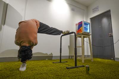 Fitness trainer Karan Bagri performs a Shaolin stretch in his home gym.