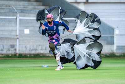 Rahul Tewatia performs parachute sprints during a Rajasthan Royals training session.