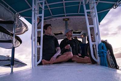 Ian Walsh and Greg Long on a boat in Mexico