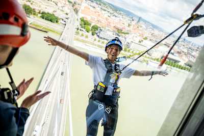 A team member from The Matadors of the United Kingdom completes the Sky Walk challenge during Red Bull Can You Make It? in Bratislava, Slovakia on May 25, 2024.