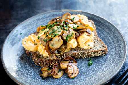 Spinach and mushroom scrambled eggs on toast is Billy's go-to brekkie