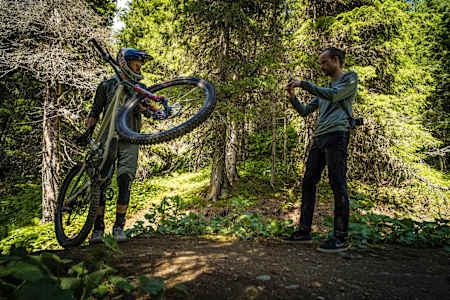 Martin Söderström holds his mountain bike during a bike whip tutorial at Åre bike park in Sweden.