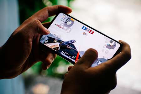 A gamer plays PUBG Mobile on a realme phone.