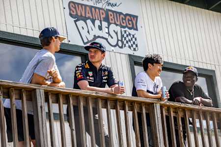 Jett Lawrence, Max Verstappen, Yuki Tsunoda, and Zion Wright talk strategy before attempting swamp buggy racing.