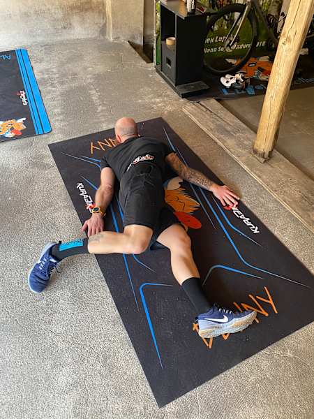 Athlete stretches and makes a scorpion.