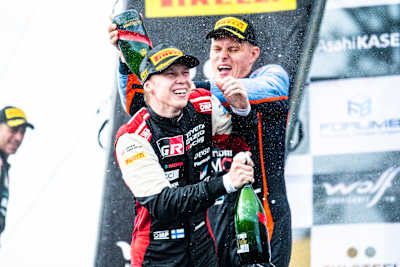 Welcome to the club: Ott Tänak baptises new champion Kalle Rovanperä at Rally New Zealand.