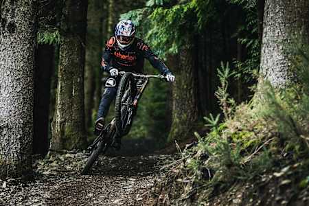 Gee Atherton performs on the prototype Atherton Bikes downhill bike in the Dyfi, Wales on January 12, 2018.