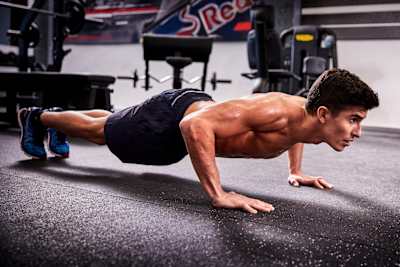 Marc Márquez, the 2018 motoGP world champion performs press ups in a training session ahead of the 2018 season.