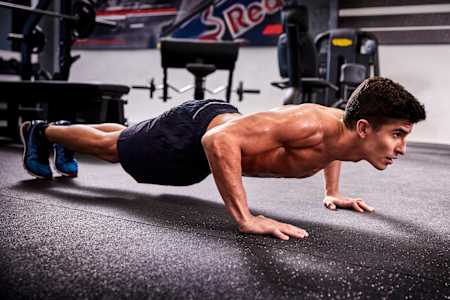 Marc Márquez, the 2018 motoGP world champion performs press ups in a training session ahead of the 2018 season.