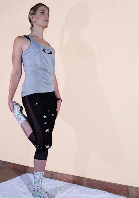 Anna Glowinski demonstrates stretches for cyclists.