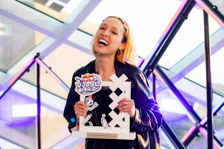 Chiara Croce of Italy, the Red Bull Doodle Art winner for 2023, poses with her trophy at the World Final in Amsterdam on May 27, 2023.