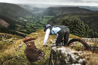 The small uphill before the berm controls the speed from the steep chute