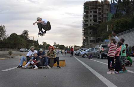 Madars Apse doing an ollie over skaters in Addis Ababa, Ethiopia on November 22, 2019