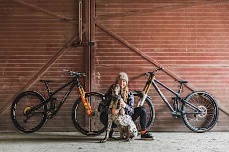 Rachel Atherton with her dog and two Atherton Racing team bikes in Wales in 2021.
