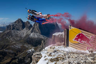 Three wingsuit pilots being catapulted into the sky at the Red Bull Ultimate Aerial Obstacle Course