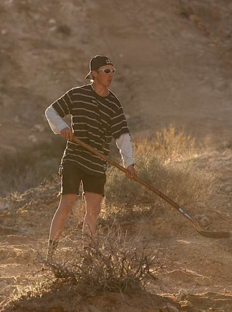 Jaxson Riddle seen working on carving a line into the Utah desert ahead of his 100ft jump.