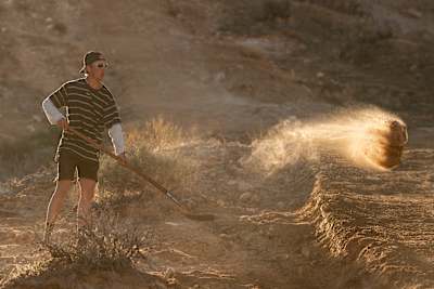 Jaxson Riddle seen working on carving a line into the Utah desert ahead of his 100ft jump.