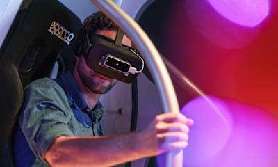 A participant wearing an Oculus Rift headset to experience the Red Bull Stratos jump.