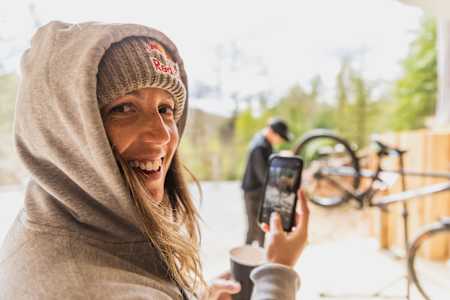 Rachel Atherton as seen using a mobile phone to record a video at Atherton Racing HQ in Wales in 2021.