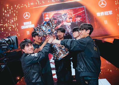 T1 team celebrate with the Summoner's Cup at League of Legends World Championships.