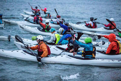 Group of kayakers set off en masse.