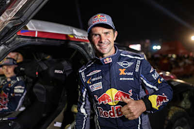 A photo of Cyril Despres, posing after finishing the Rally Dakar 2019 in Lima, Peru.
