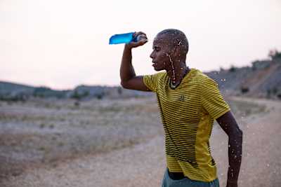 Carry a soft flask which you can fill up with water once you run out