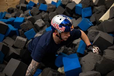 Kieran Reilly in the foam pit after landing on his BMX at Asylum Skatepark in Nottingham, England.
