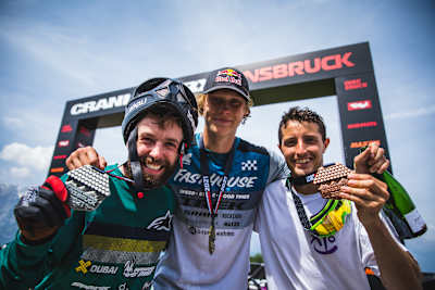 Nicholi Rogatkin, Emil Johansson and Torquato Testa pose for a portrait at Crankworx Innsbruck on June 19, 2021.