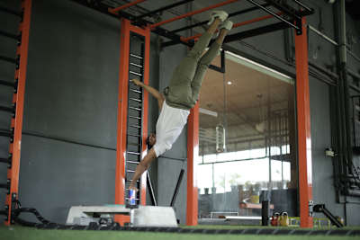 Kochi fitness trainer Nipun Viju performs calisthenics exercises in a gym.