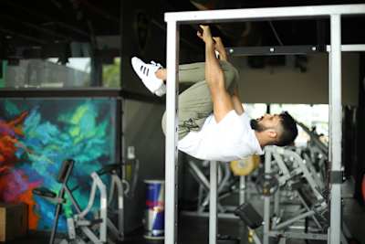 Kochi fitness trainer Nipun Viju performs calisthenics exercises in a gym.