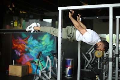 Kochi fitness trainer Nipun Viju performs calisthenics exercises in a gym.