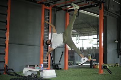 Kochi fitness trainer Nipun Viju performs calisthenics exercises in a gym.