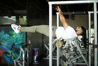 Kochi fitness trainer Nipun Viju performs calisthenics exercises in a gym.