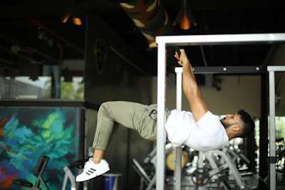 Kochi fitness trainer Nipun Viju performs calisthenics exercises in a gym.
